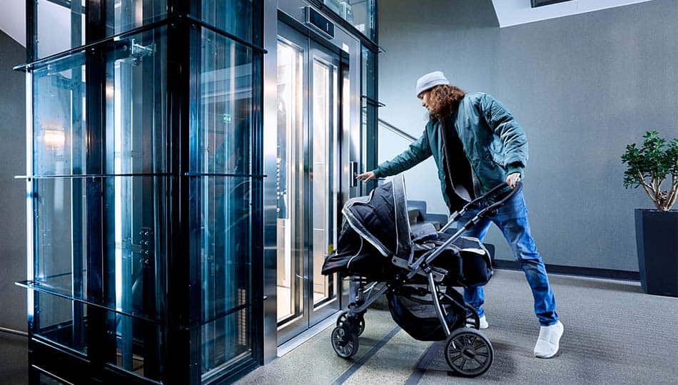 img_man_with_stroller_pressing_elevator_button_0950x535